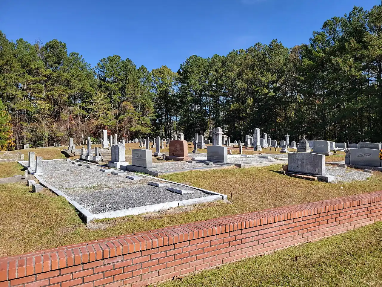 Headstones and fall trees at Mount Gilead Cemetery in Woodstock