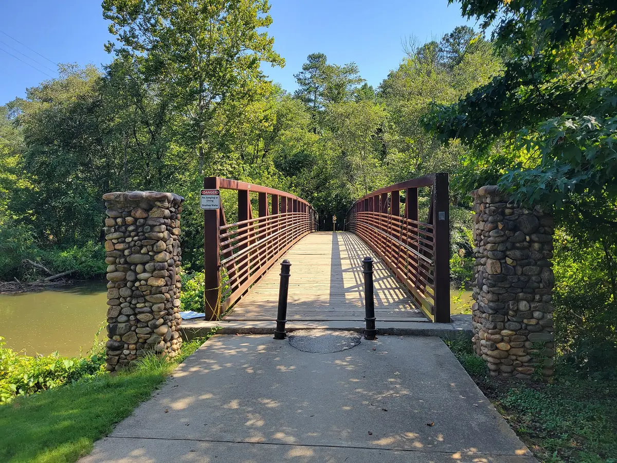 A footbridge in Olde Rope Mill Park on the Little River, beside the River Park neighborhoods in north Woodstock